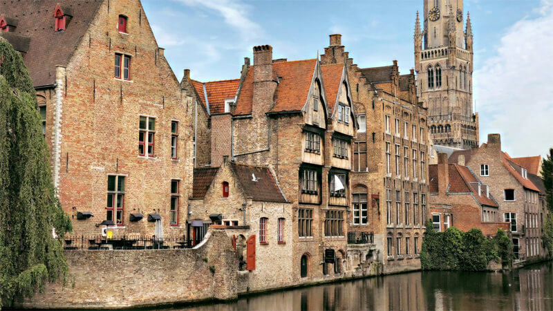 prime tours The Canals of Bruges Benelux Photo by Despina Galani on Unsplash